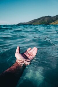 person soaking on body of water