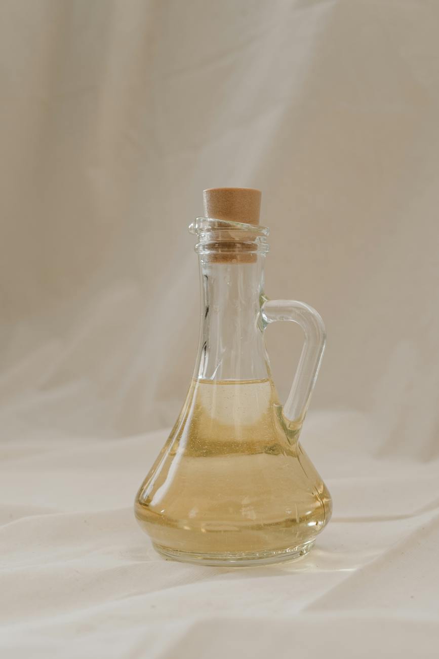 clear glass bottle with liquid